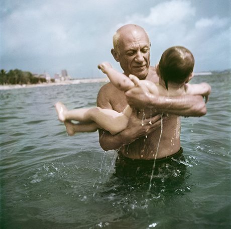 Pablo Picasso playing in the water with his son Claude, Vallauris, France, 1948